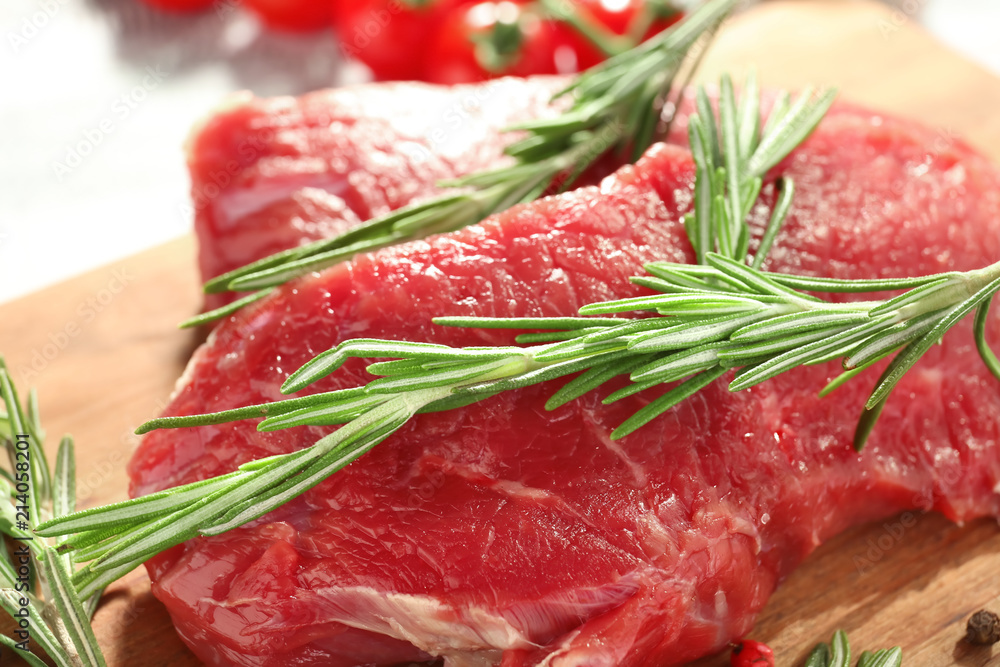 Fresh raw meat with rosemary, closeup