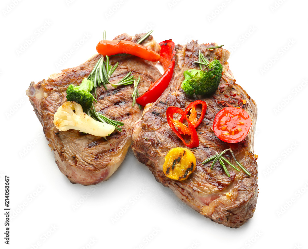 Grilled meat with vegetable garnish on white background