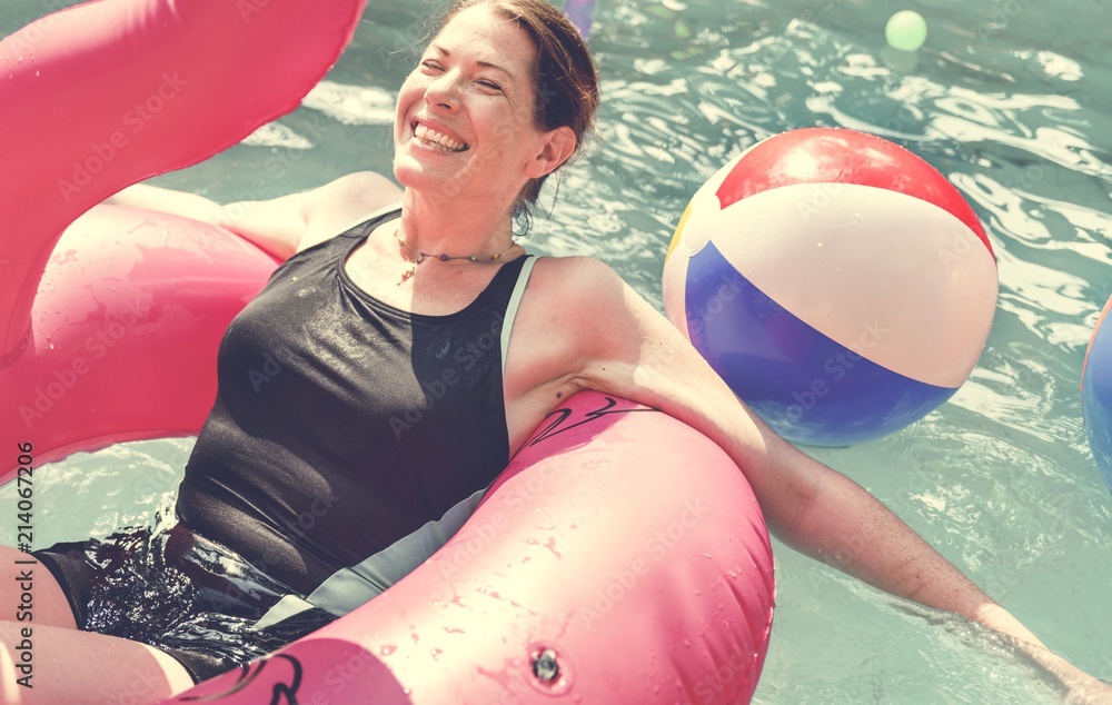 Woman enjoying the water in a swimming pool