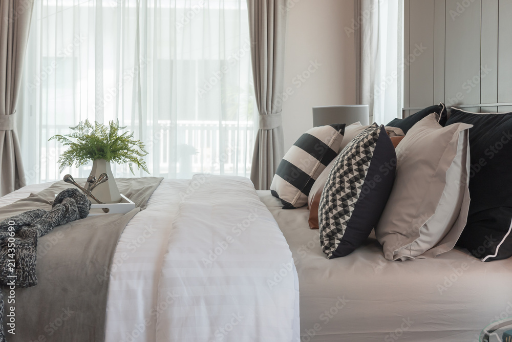 modern bedroom with plant in vase