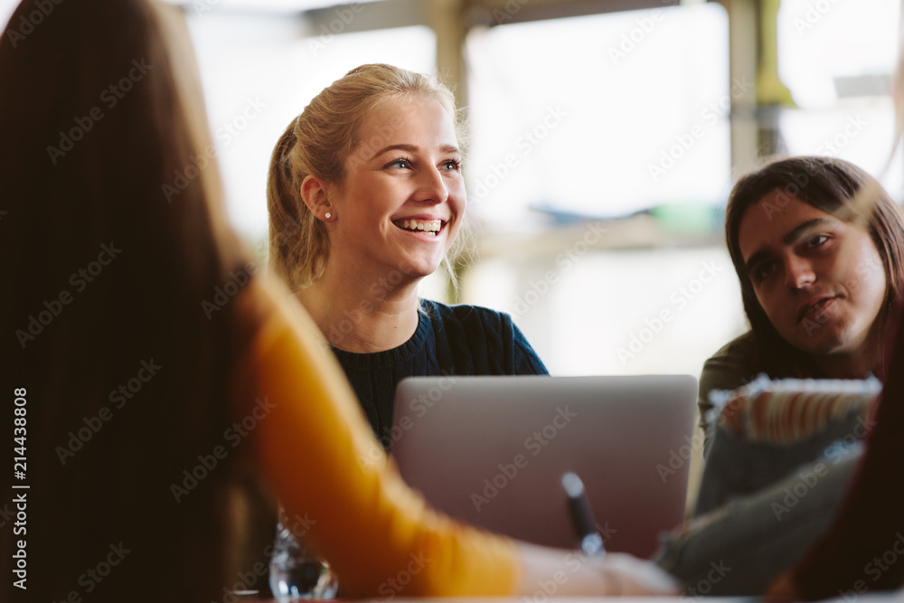 University students in classroom after lecture