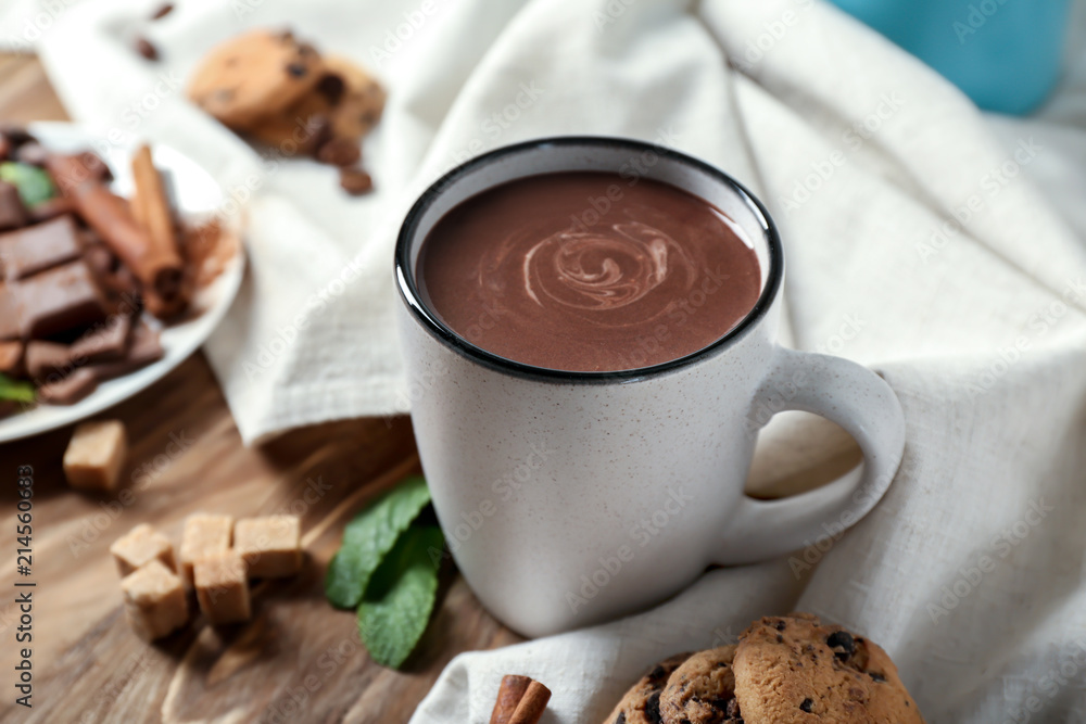 Cup of hot chocolate on wooden table