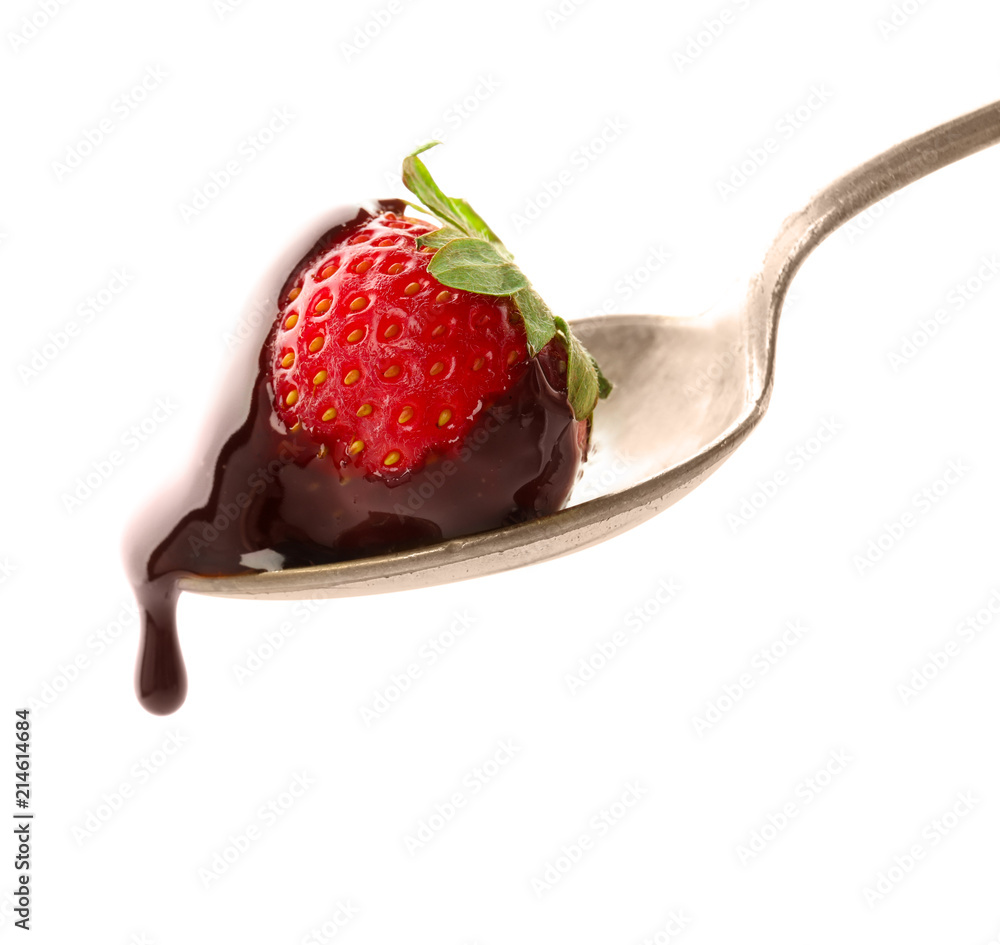 Spoon with delicious strawberry and melted chocolate on white background