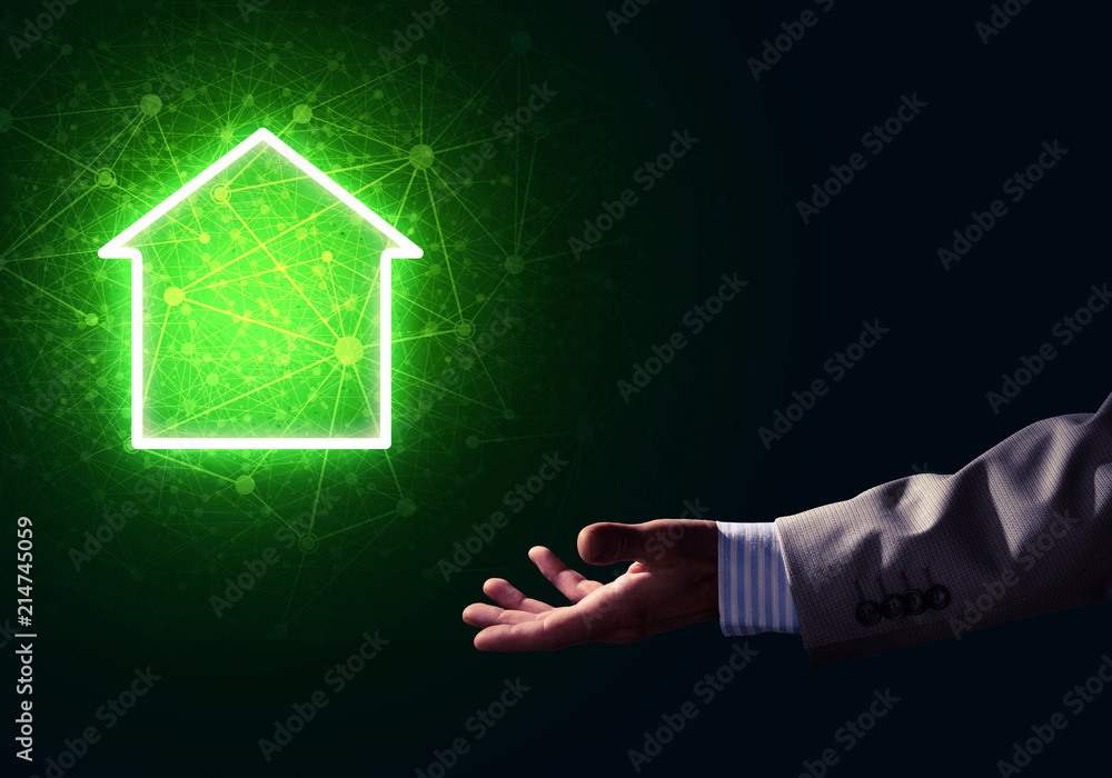 Conceptual image with hand pointing at house or main page icon o