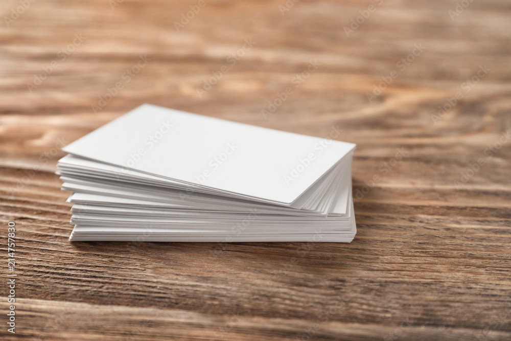 Blank business cards on wooden background