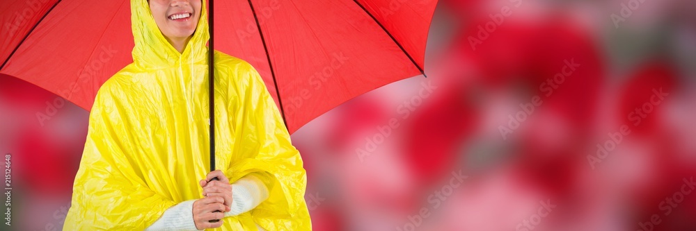 身穿黄色雨衣的女子撑着伞的合成图像