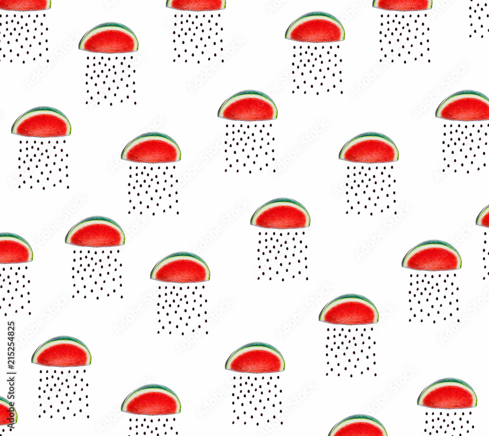 Watermelons and seeds rain concept on a white bakcground