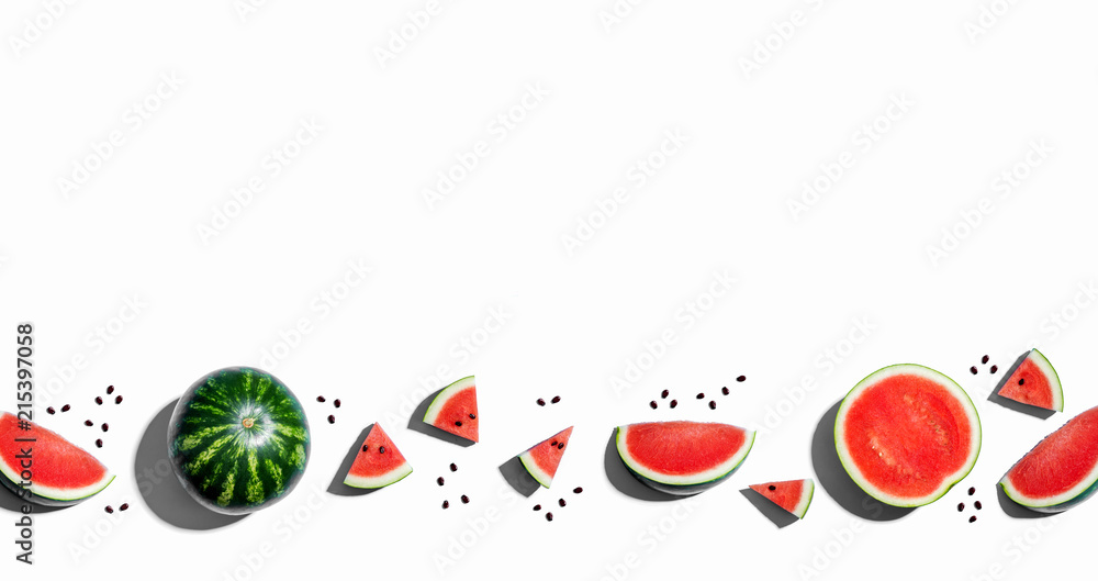 Whole and sliced watermelons on a white background