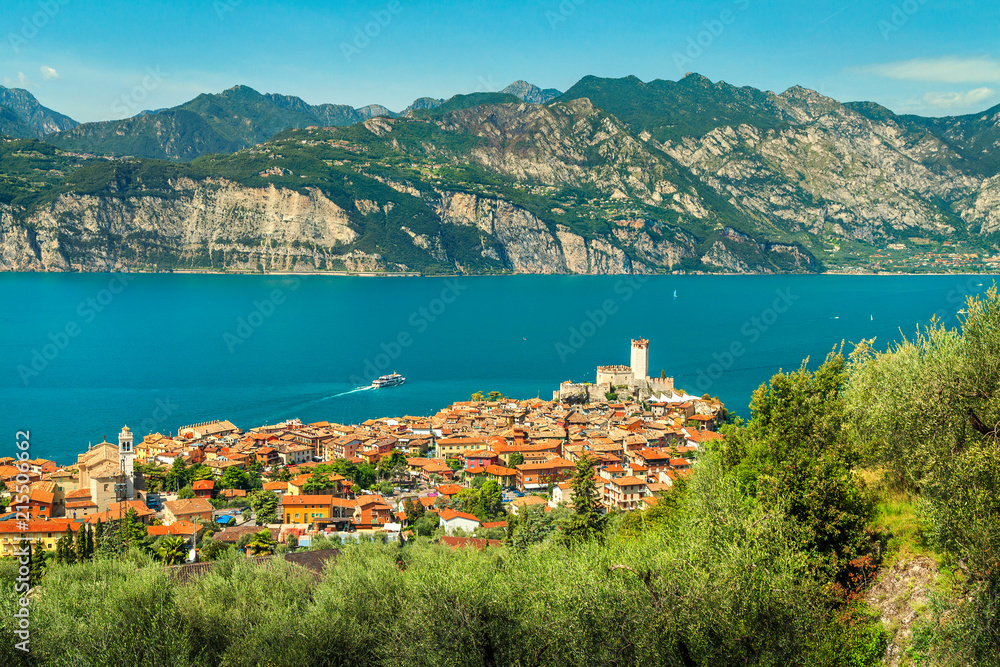 Famous Malcesine tourist resort and high mountains, Garda lake, Italy