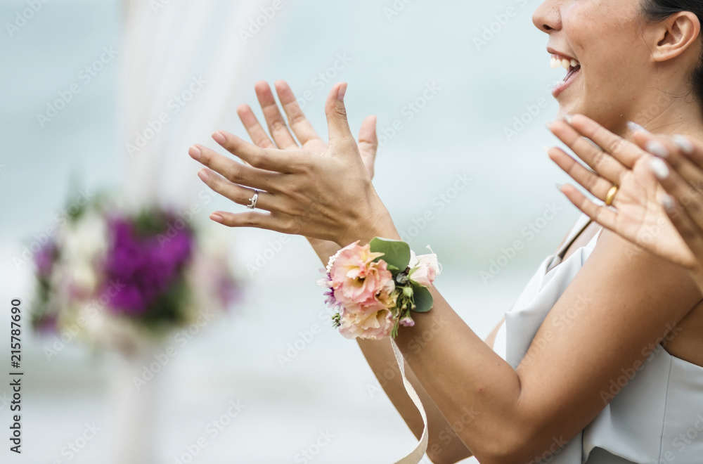 Wedding guests clapping for the bride and groom