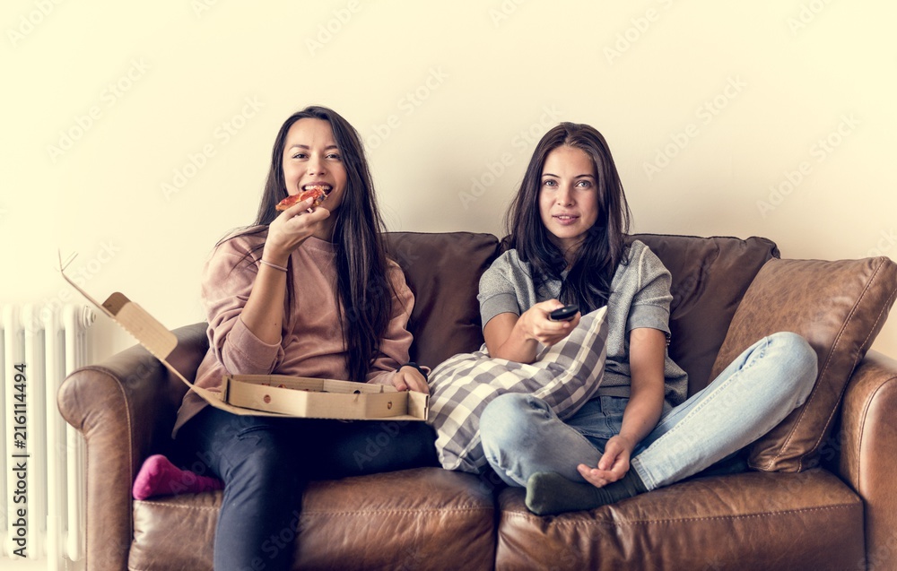 Friends eating pizza together