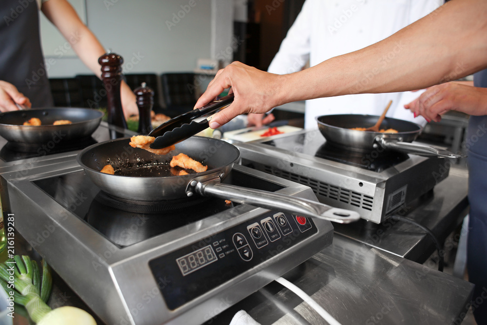 Male chef cooking in restaurant kitchen