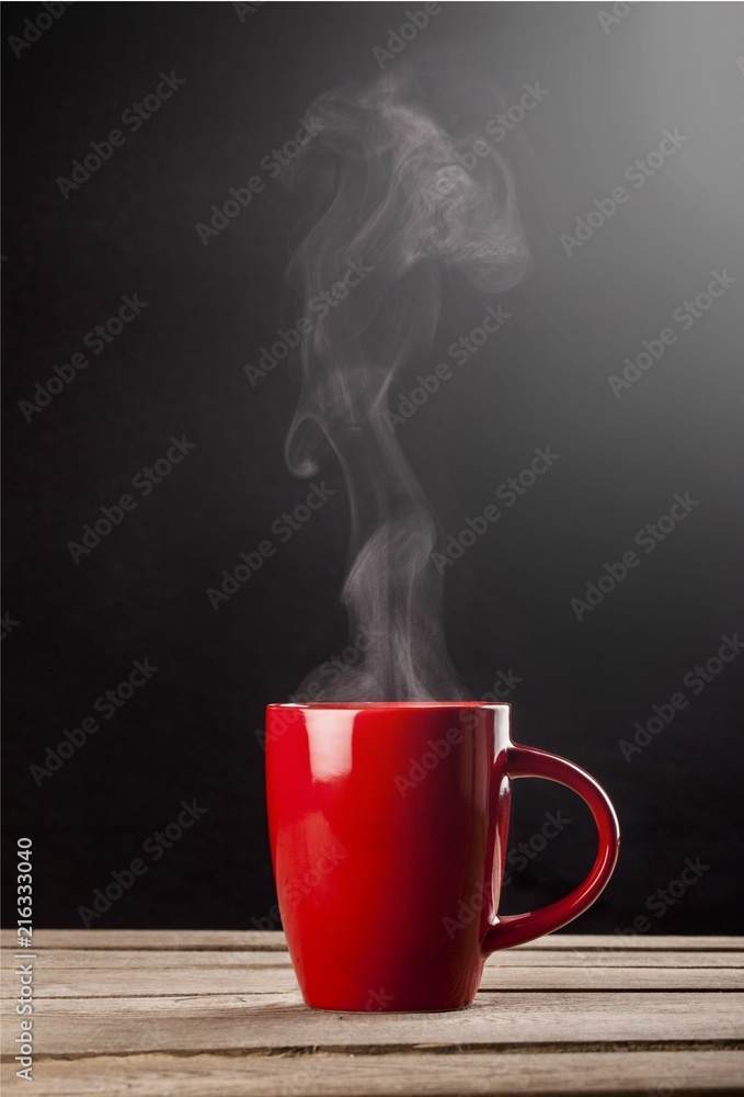 Red hot cup of coffee on black