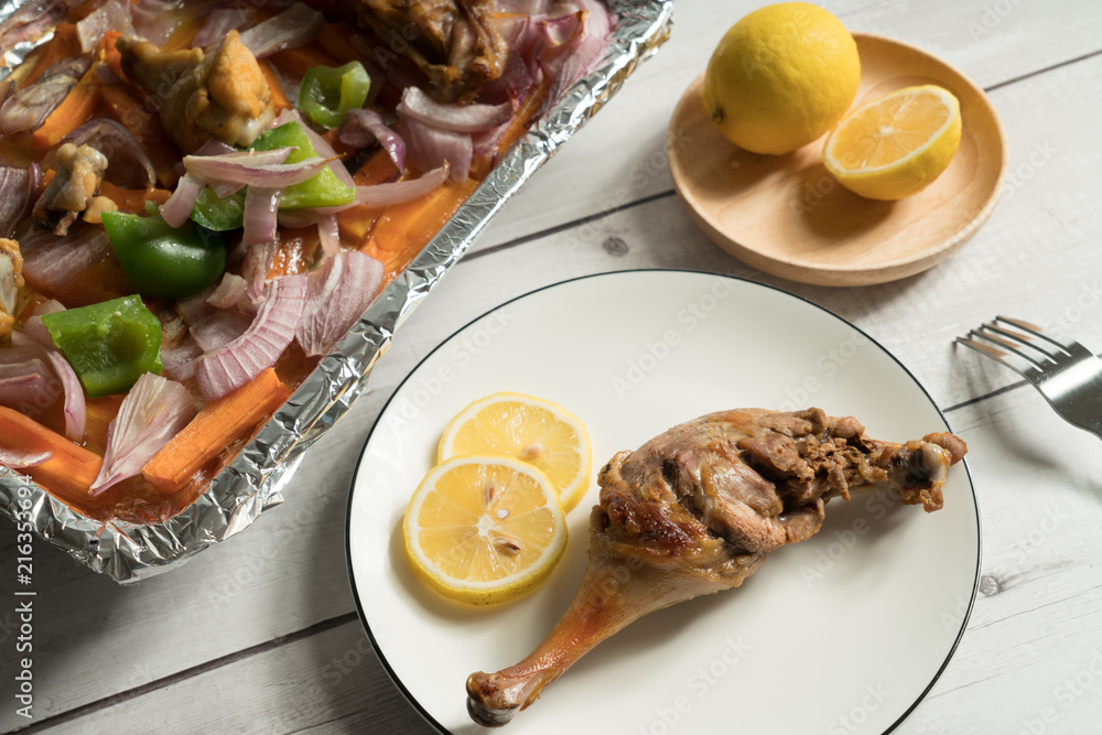 Roast duck leg on the wooden table