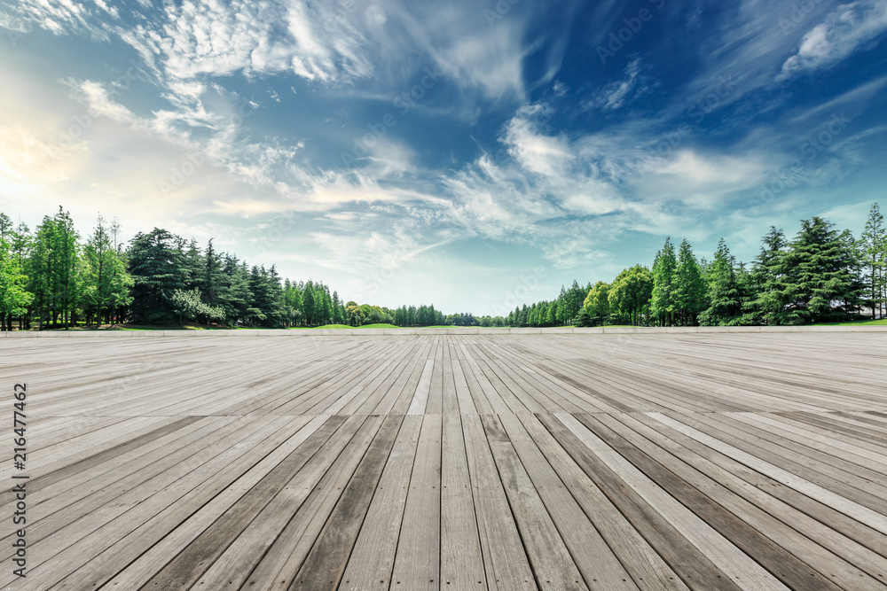 Wood square floor and green trees natural landscape