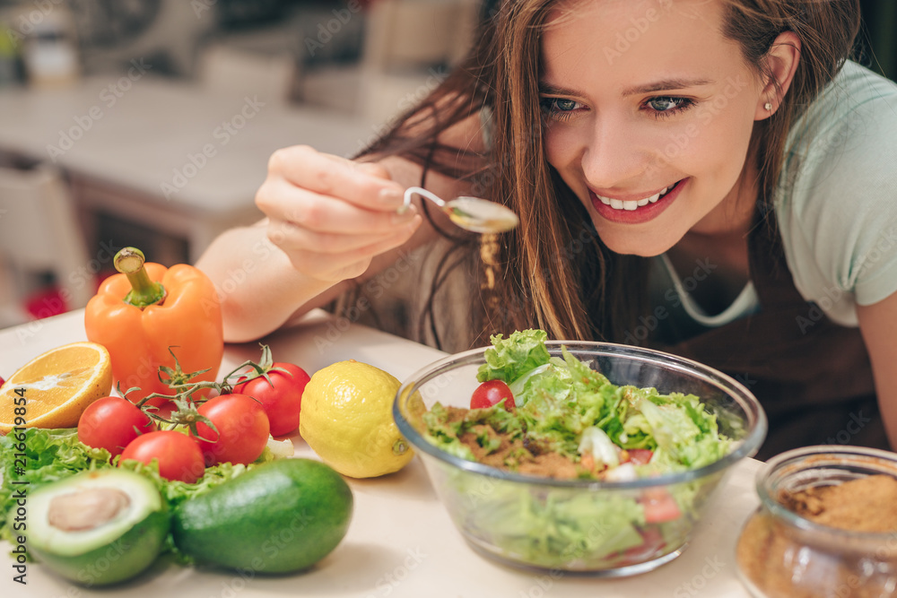 Smiling girl in the kitchen