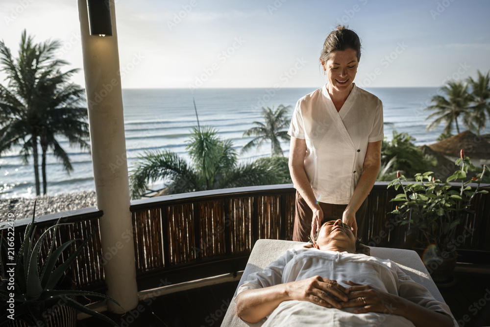 Massage therapist massaging at a spa