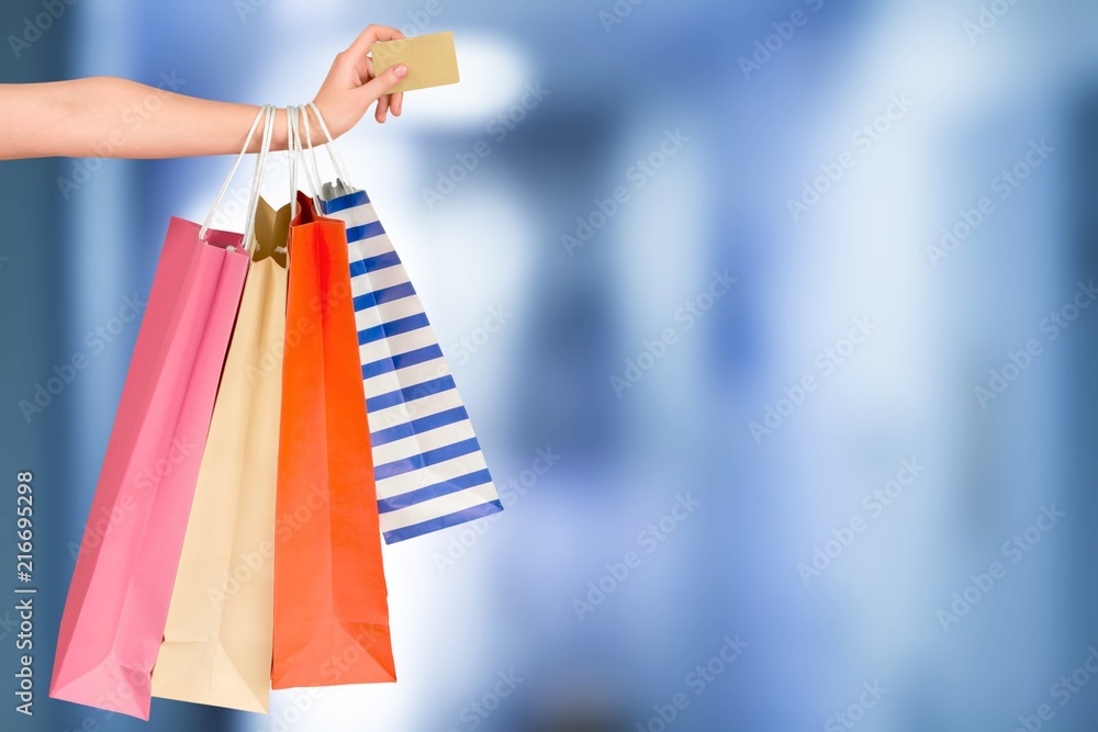 Woman with shopping bags and card