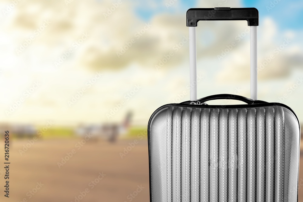 Big travel suitcase on background