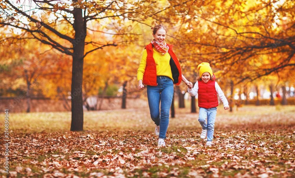 happy family mother and child daughter on   autumn walk .