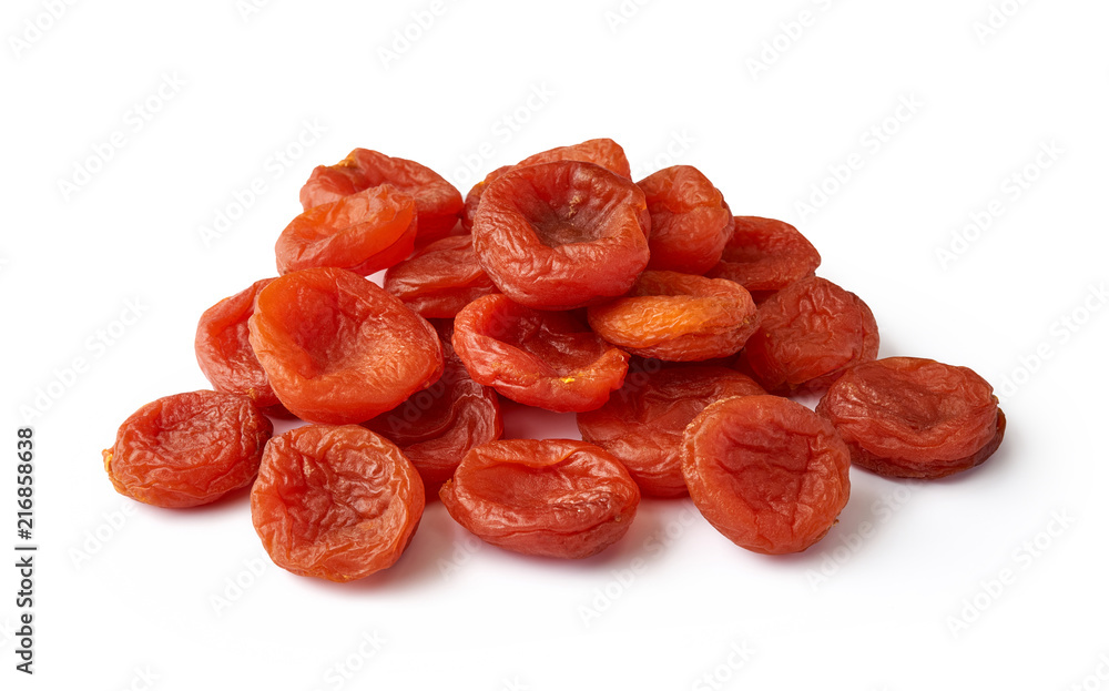 Heap of dried apricots isolated on white background. Fruit dried in the sun.