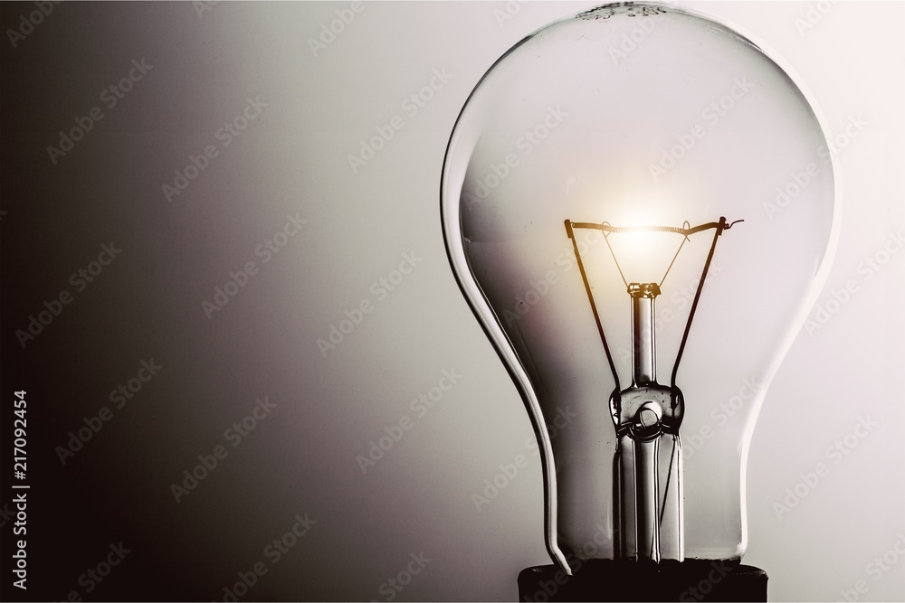 Glowing yellow light bulb, busienss idea concept