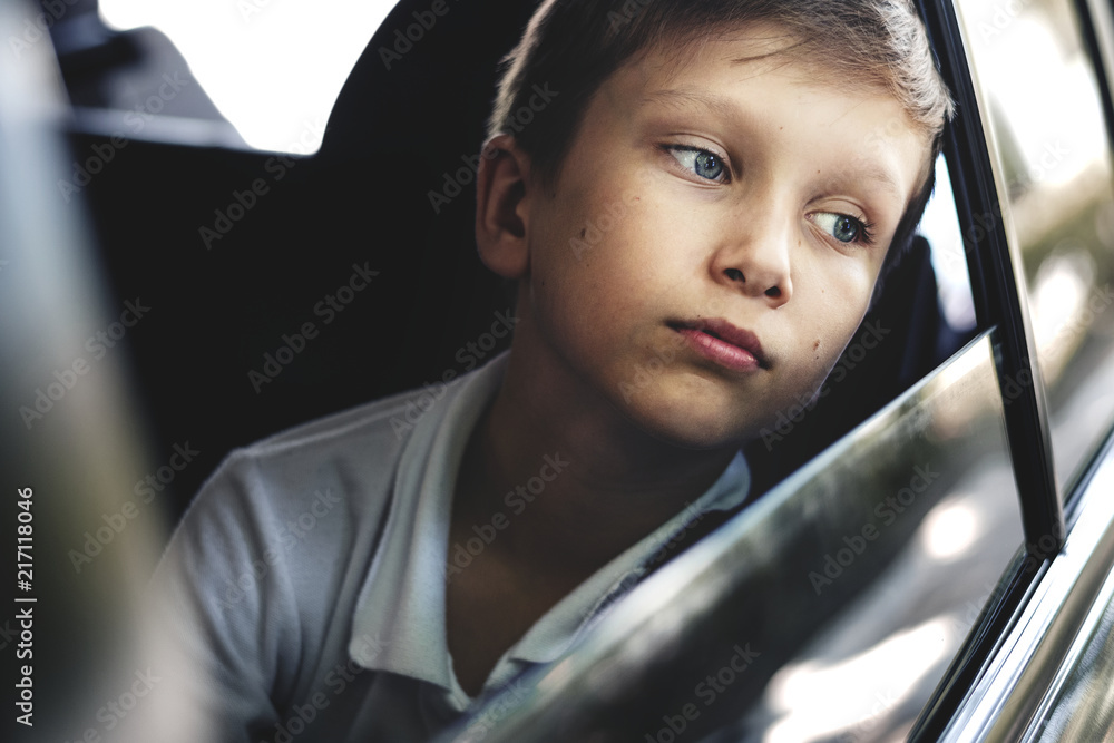 Boy looking out the car window