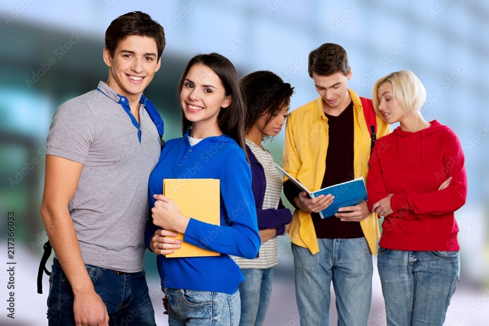 Group of students with books on background