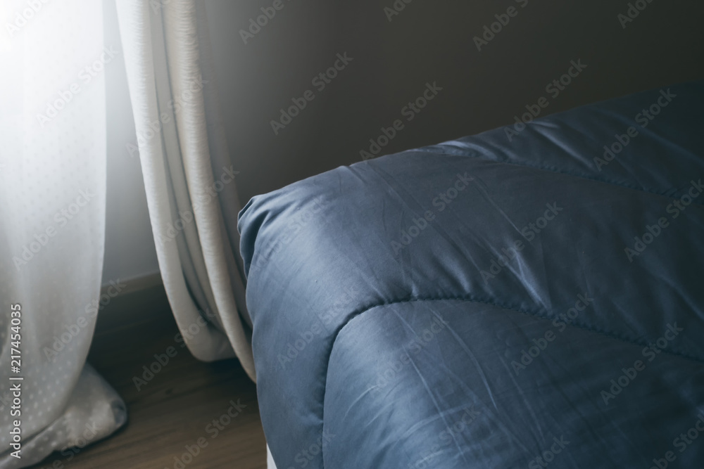 close up soft bed blanket and fur carpet rug near window bedroom