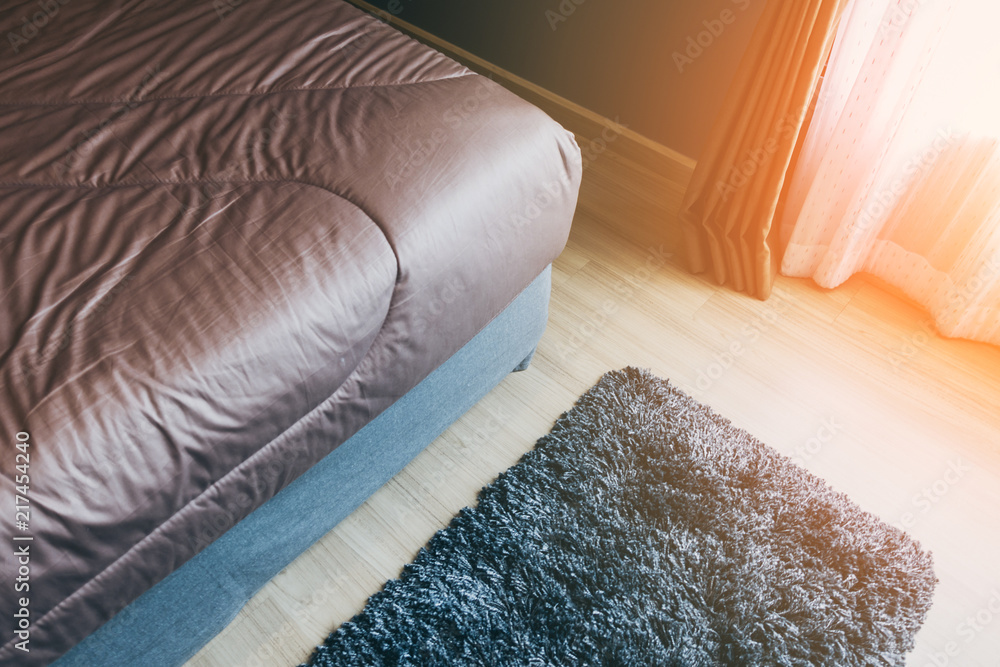 close up soft bed blanket and fur carpet rug near window bedroom