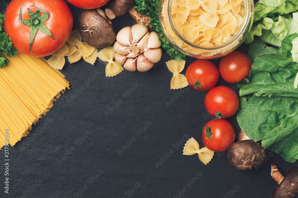 Italian food concept. Pasta ingredients. Cherry-tomatoes, spaghetti pasta, rosemary and spices