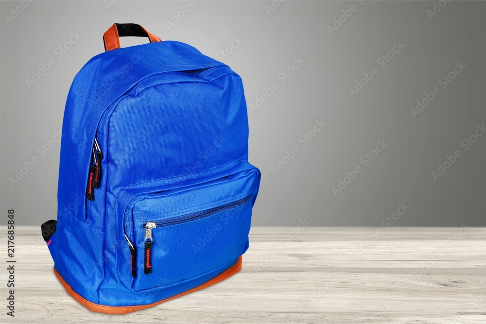 Blue school bag on background