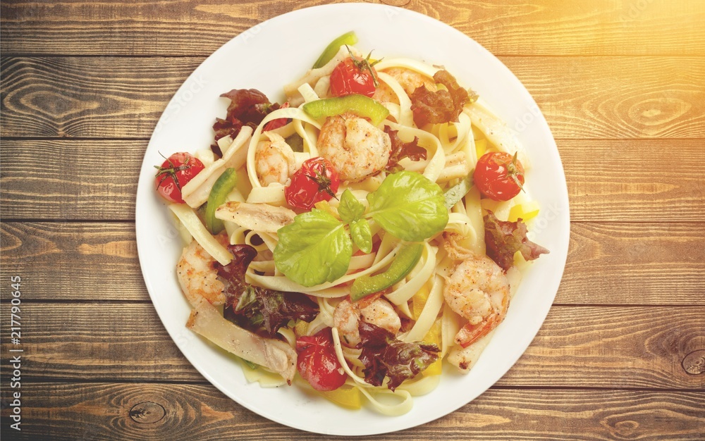 Spaghetti with shrimps,tomatoes and chopped parsley