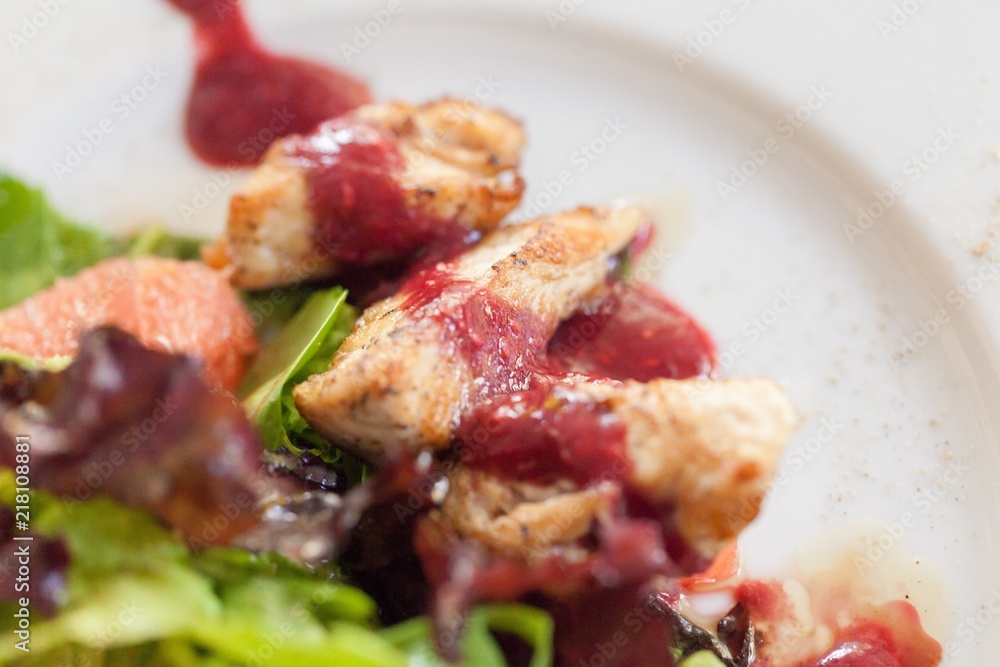 Closeup of a Salad with Chicken and Red Sauce