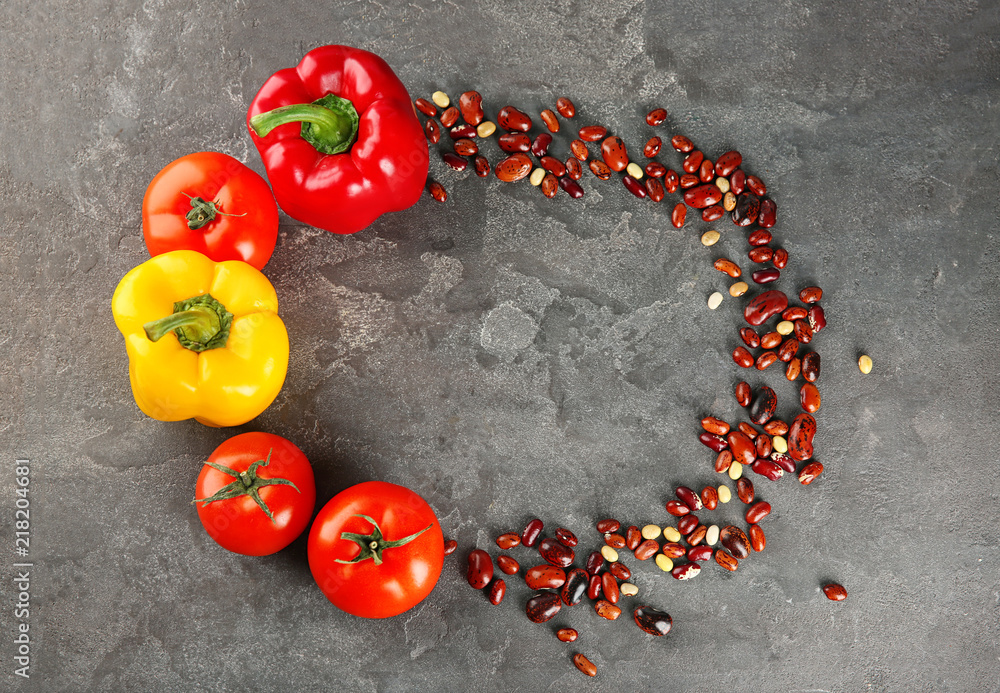 Raw vegetables and beans on grey background. Diet food