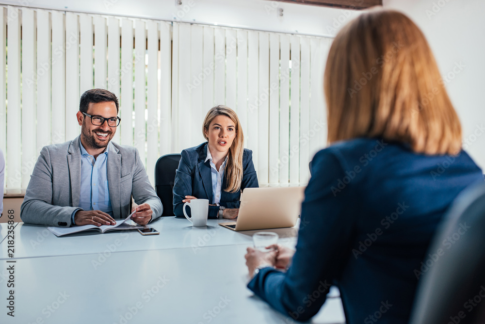 Hr managers having a meeting with a female candidate.