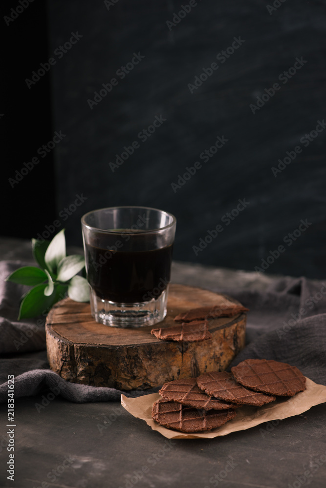 Glass cup of coffee and Chocolate chip cookies on the table