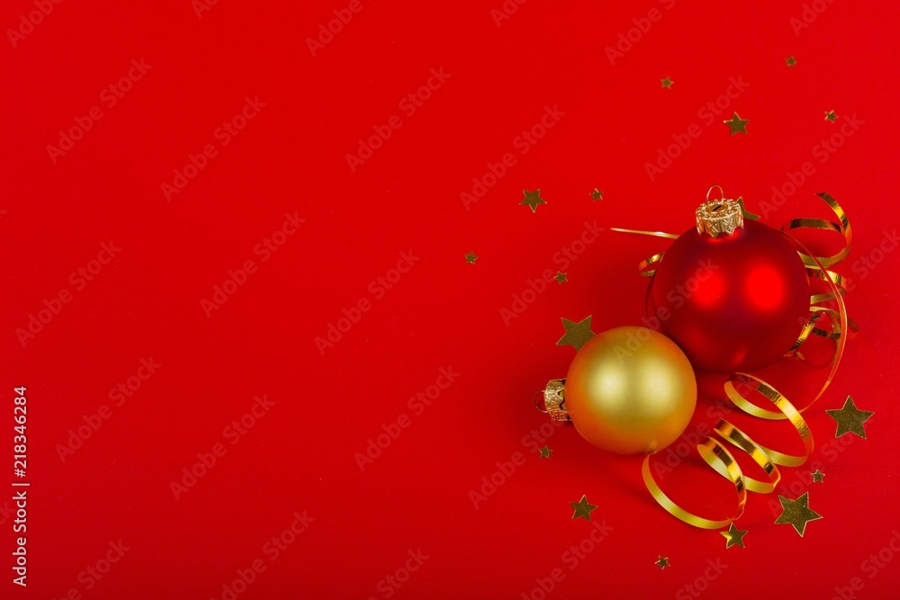 Christmas Baubles and Ribbon on the Red Background