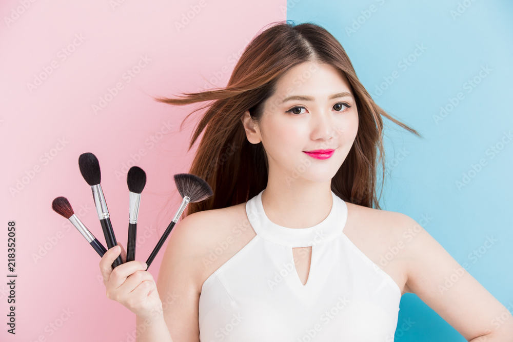 pretty girl take makeup brush