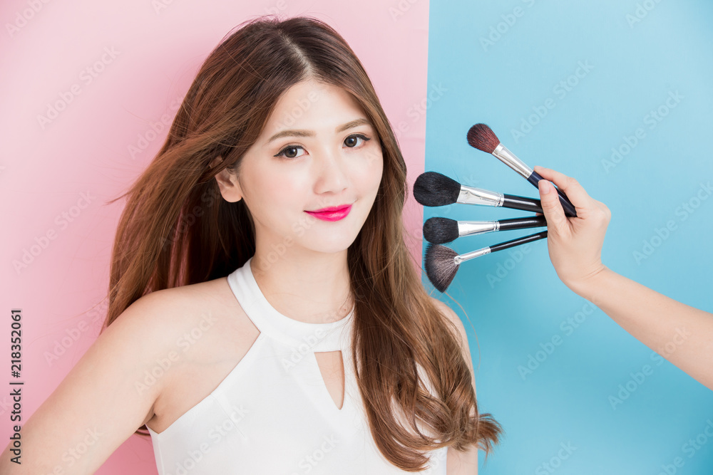 pretty girl take makeup brush