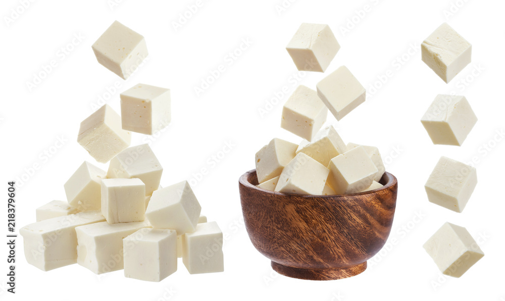 Feta isolated. Falling pieces of white cheese