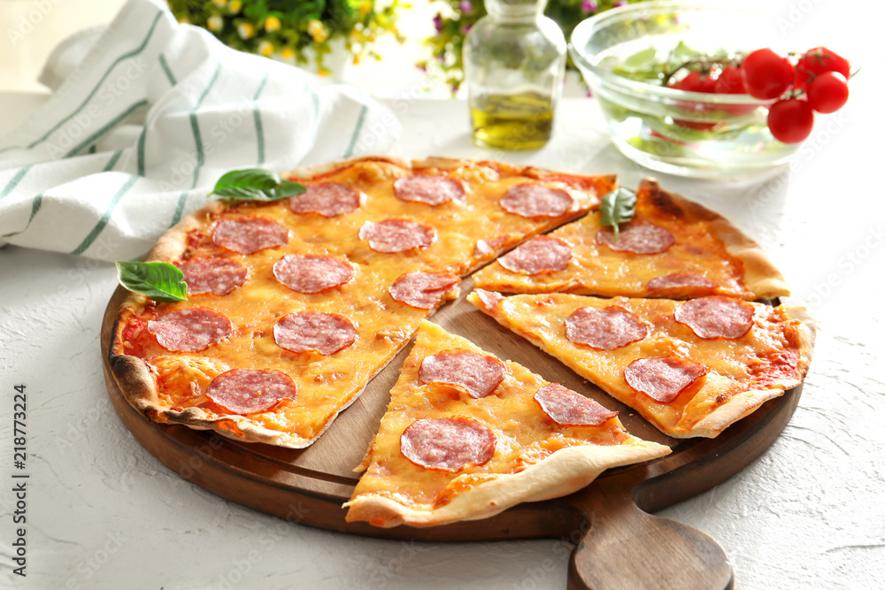 Tasty sliced Pepperoni pizza on table