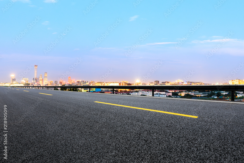 Panoramic beijing skyline and buildings with empty road