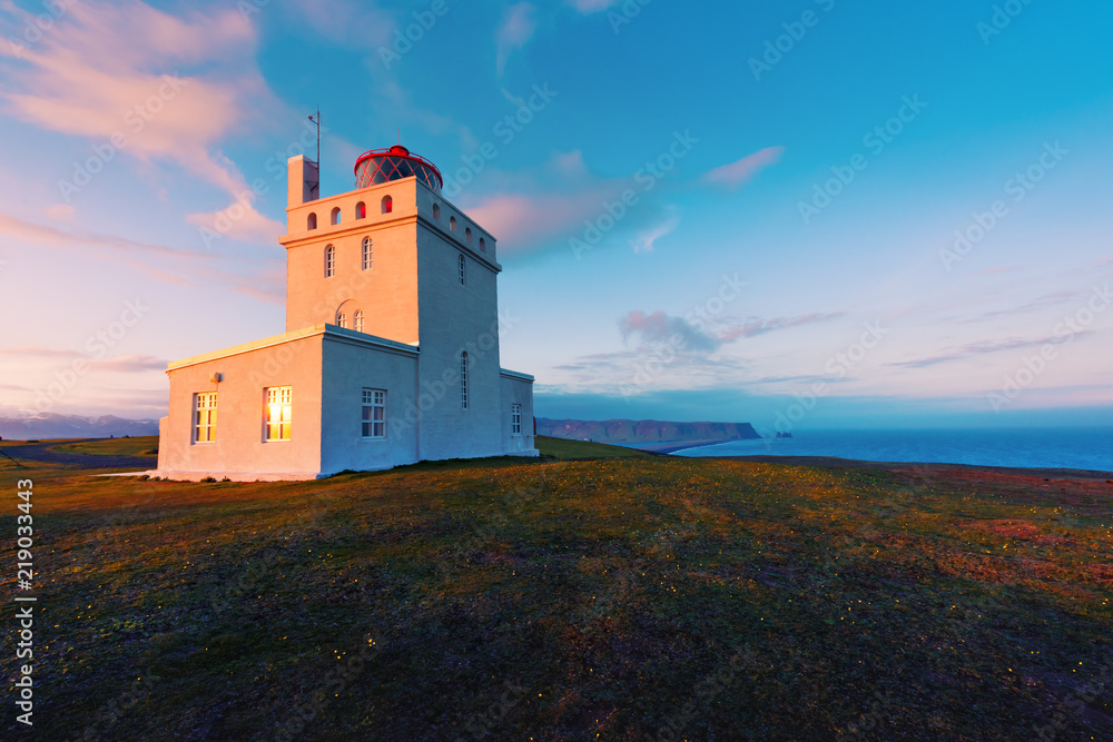 White lighthouse at Cape Dyrholaey, Iceland. Landscape photography