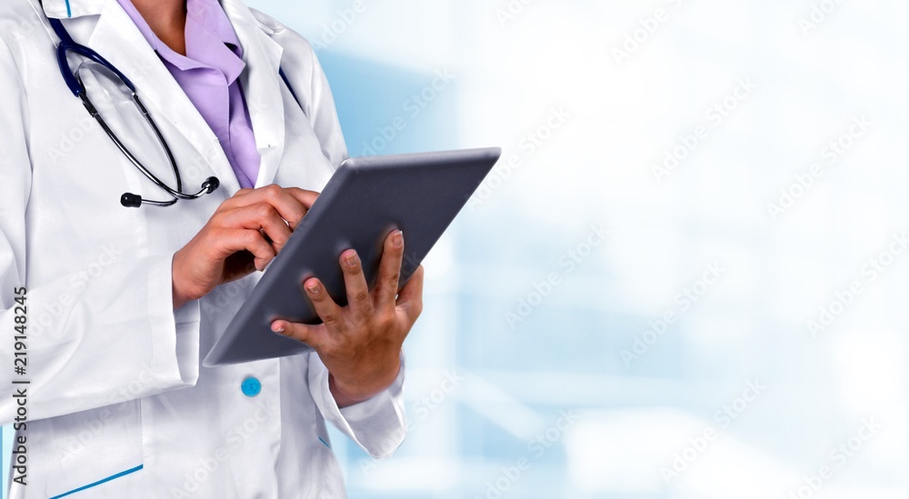 Close-up Doctor at hospital working with tablet pc