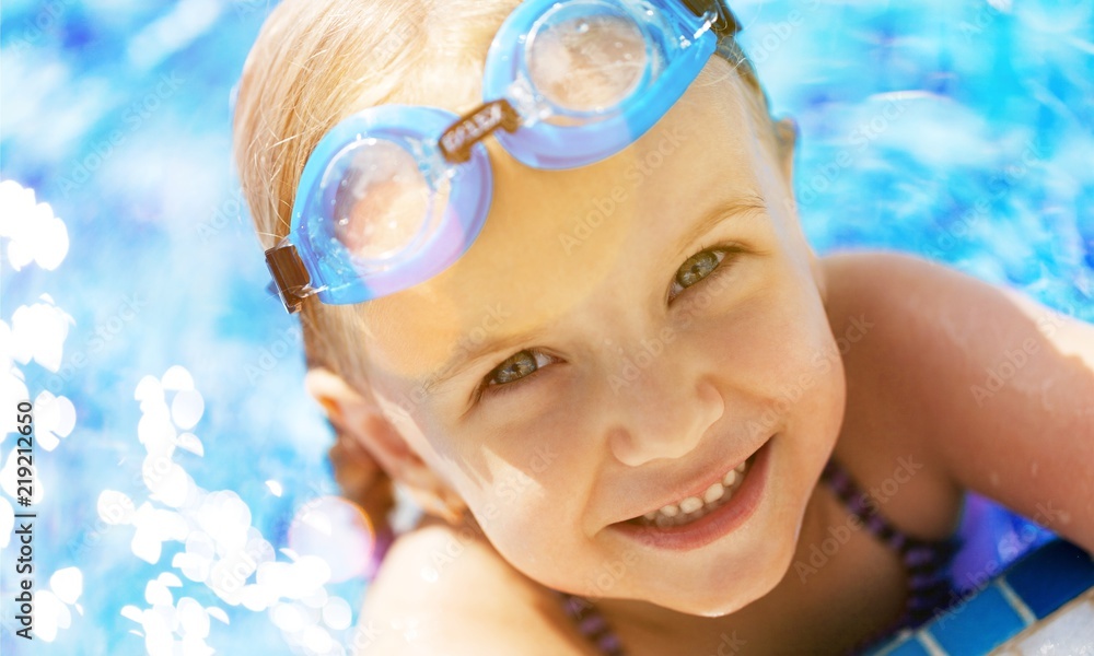 Beautiful little girl sunning at the pool