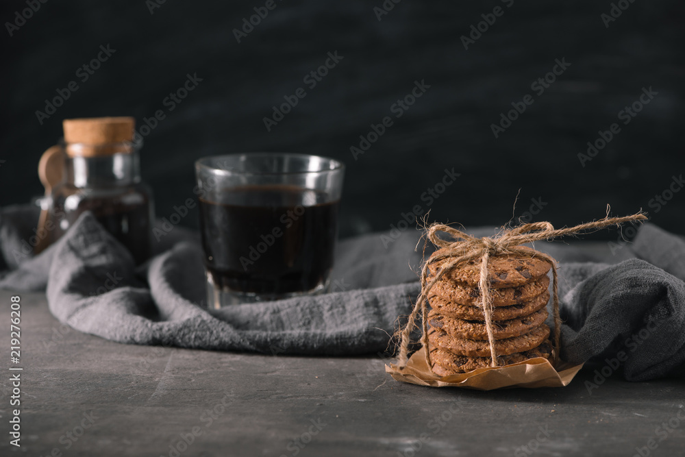 Glass cup of coffee and Chocolate chip cookies on the table