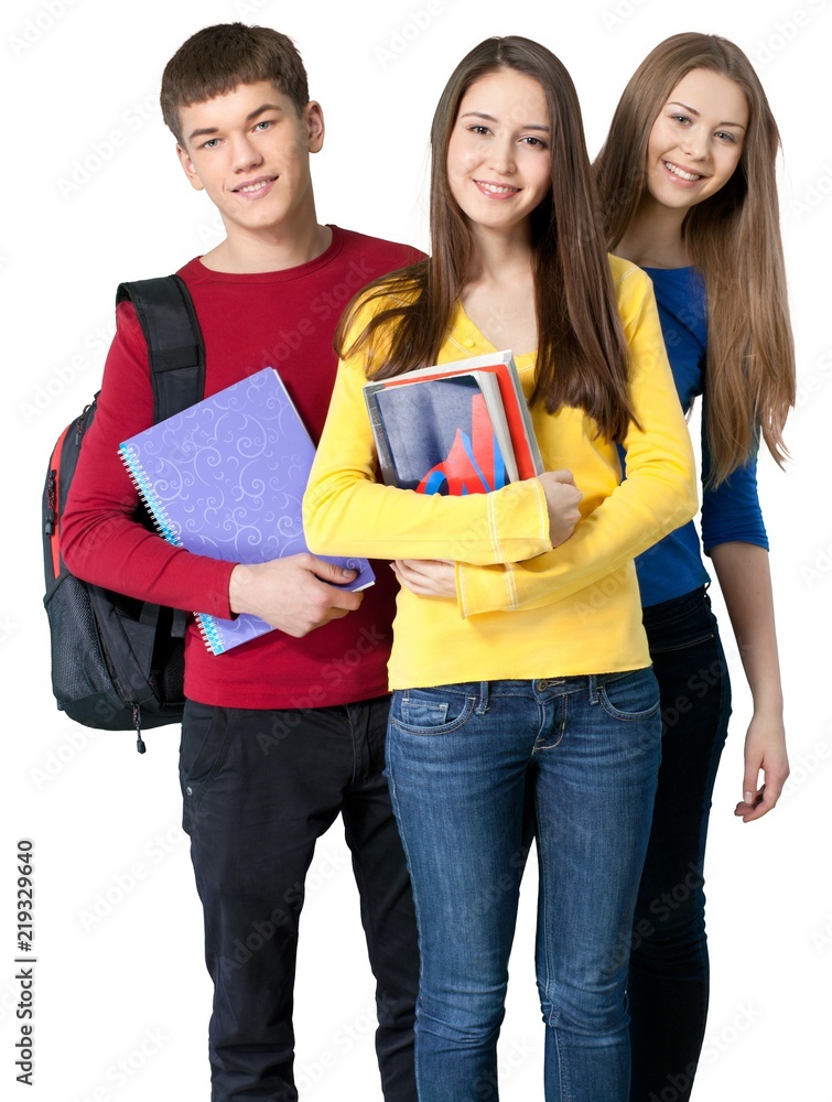 Group of young students together carrying textbook and notebook