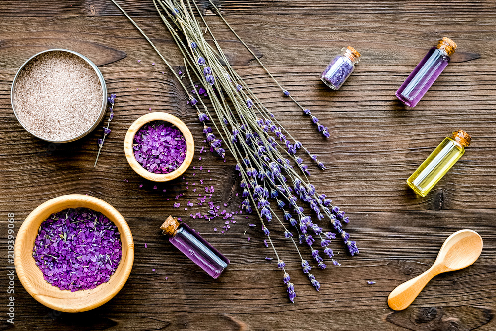 organic cosmetics with lavender on wooden background top view