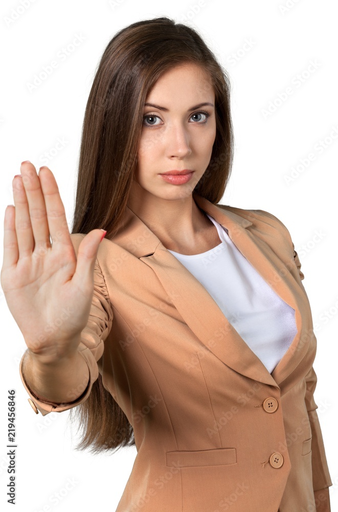 Woman showing stop sign isolated on white background